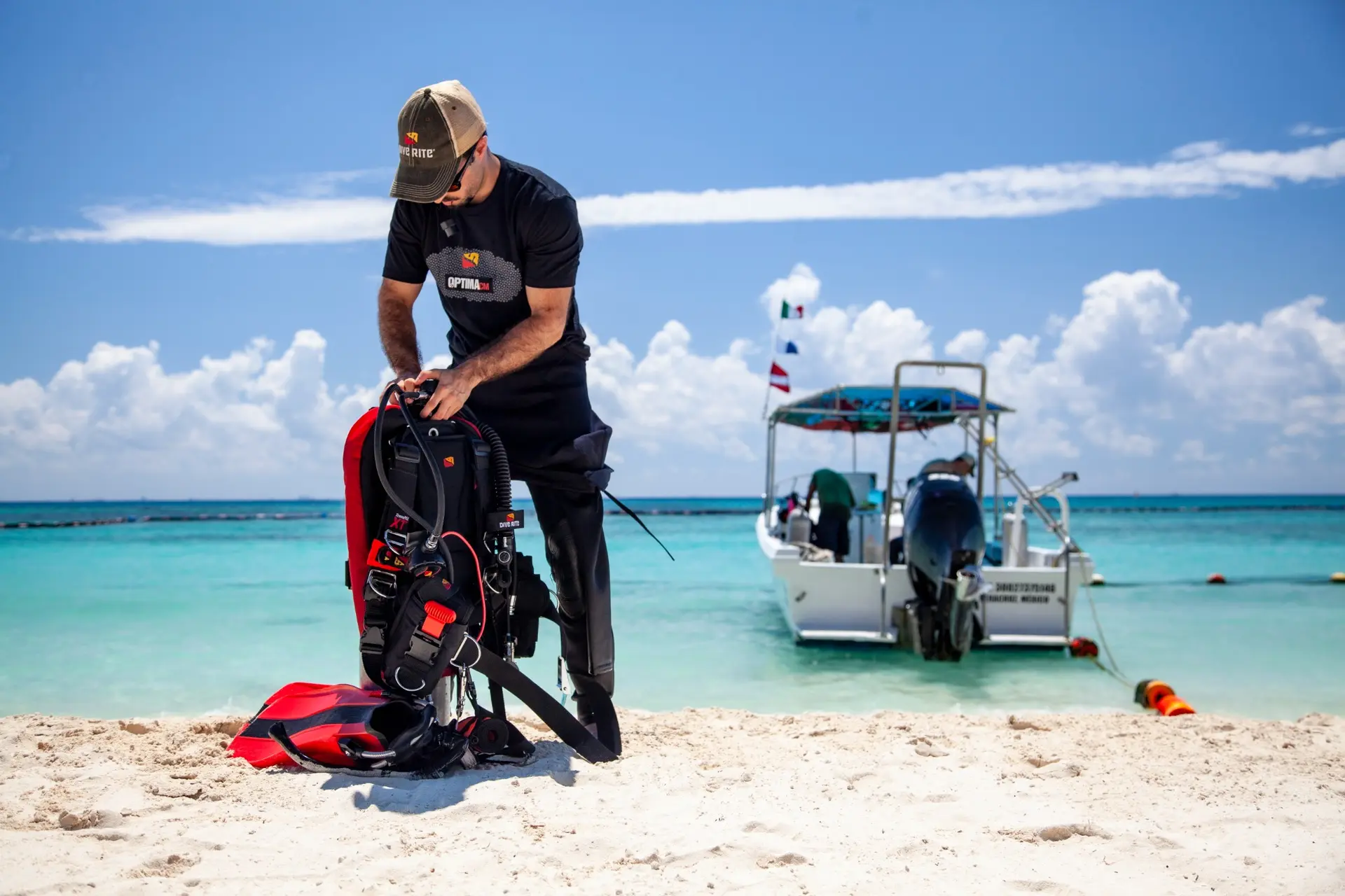 Diver preparing Dive Rite equipment beside the Mexican Caribbean