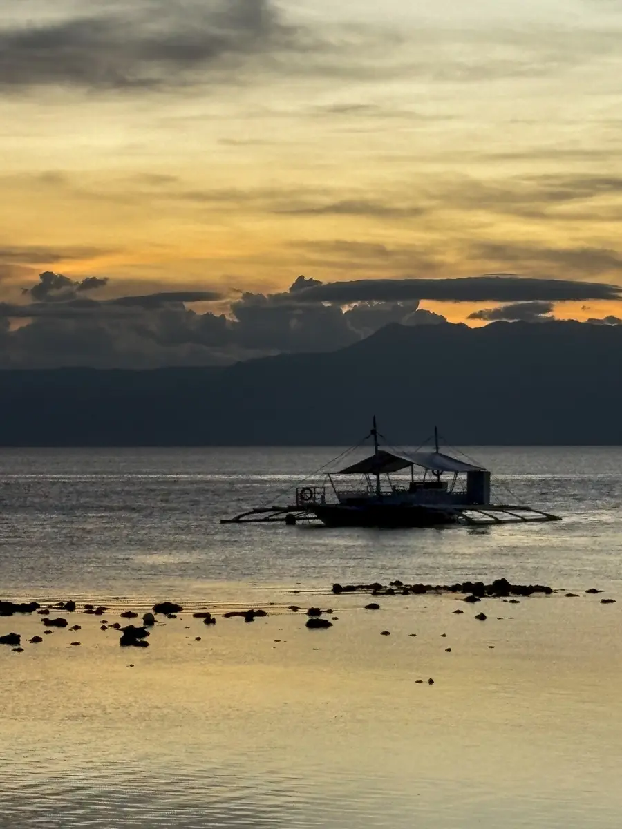 Traditional bangka boat at sunset in the Philippines